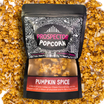 A Prospector Popcorn Pumpkin Spice place on top of pumpkin spice gourmet popcorn