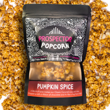 A Prospector Popcorn Pumpkin Spice place on top of pumpkin spice gourmet popcorn