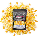 A bag of Buffalo Ranch gourmet popcorn lays on a pile of its own popcorn.