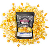 A bag of Buffalo Ranch gourmet popcorn lays on a pile of its own popcorn.