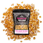 A bag of Maple Walnut Ice Cream popcorn lays on a pile of its popcorn.