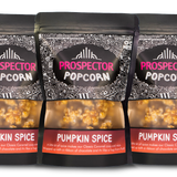 Three bags of Prospector Popcorn Pumpkin Spice flavor on a white background