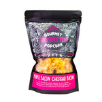 A bag of Maple Bacon Cheddar Bacon Gourmet Popcorn sits on a white background